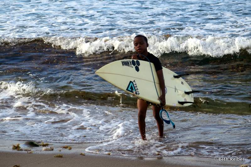 A young surfer in Barbados